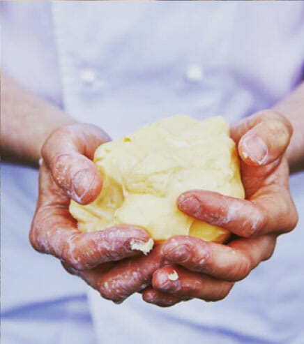 ball of butter being hand-worked
