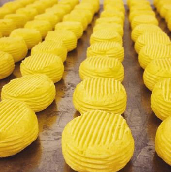 freshly paddled butter rounds resting on a tray